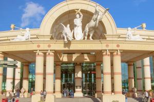 a building with statues on the front of it at Stylish two-bedroom Salford Quays apartment in Manchester