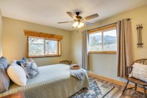 a bedroom with a bed and a ceiling fan at Idyllic Rye Cabin Deck with Mountain Views! in Rye