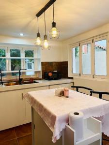 a kitchen with a table with paper towels on it at Casa céntrica Las Higueras in Tarija