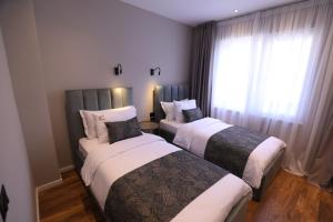 Rúm í herbergi á Dallga Suites