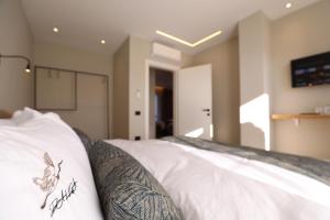 Rúm í herbergi á Dallga Suites