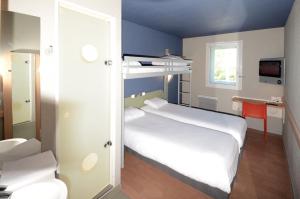 Postel nebo postele na pokoji v ubytování ibis budget Brive La Gaillarde