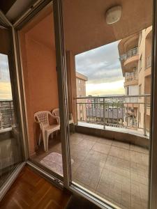 a balcony with a view of a balcony with a table at Apartman Edita in Sarajevo