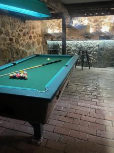 a pool table with a ball on top of it at Etno Selo Stara Planina in Kalna