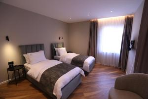 Rúm í herbergi á Dallga Suites