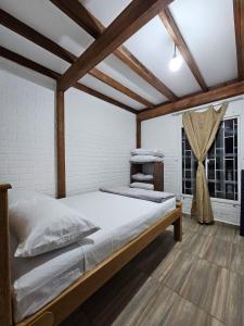 a large bed in a room with a window at Chalet Los Sinsontes in San Rafael +27 photos