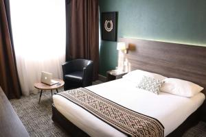 Voodi või voodid majutusasutuse Best Western Plus Hotel Admiral toas