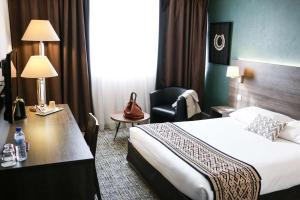 Voodi või voodid majutusasutuse Best Western Plus Hotel Admiral toas