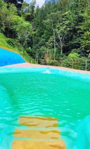 a painting of a body of water with a beach at Chalet Los Sinsontes in San Rafael