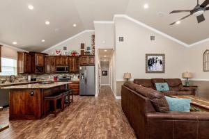a living room with a couch and a kitchen at River Road Villas #2 in New Braunfels