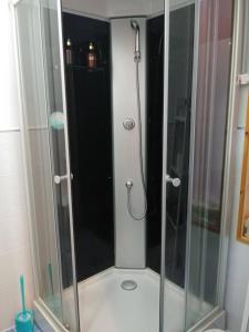 a shower with a glass door in a bathroom at Soop and Soop Pension in Pyeongchang