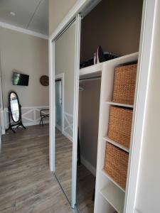 a mirrored closet with a mirror in a room at Hidden Valley Private Guest Suite with Views in South Grafton