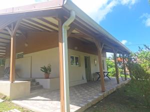 awning over a patio of a house at Villa Kikine in Le Diamant