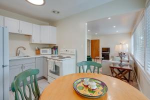 a kitchen with a table with a plate of food on it at Charming Oakland Apartment Near Lake Merritt! in Oakland