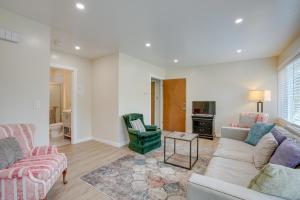 a living room with a couch and a table at Charming Oakland Apartment Near Lake Merritt! in Oakland