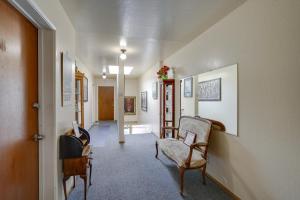 a hallway with two chairs and a room with a hallway at Cozy Oakland Studio Rental, 13 Mi to San Francisco in Oakland