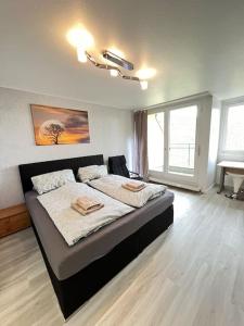 Кровать или кровати в номере neue Wohnung im Gebäude des Graf Eberhard Hotels