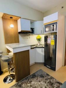 Kuchyň nebo kuchyňský kout v ubytování Cozy Room in Davao by CA Suites