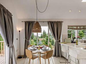 a kitchen and dining room with a table and chairs at 2 Bed in Totnes 93062 in Marldon