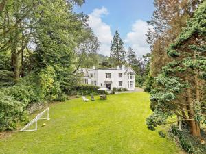 an aerial view of a large white house with a yard at 3 Bed in Machynlleth 93080 in Cemmaes