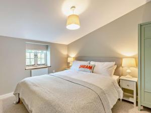 a bedroom with a large white bed with two lamps at 2 Bed in Barnstaple 5mls N 93023 in Chapelton