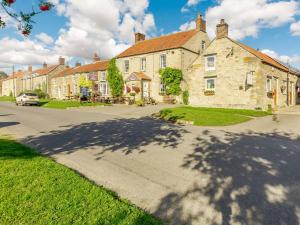 a large stone house on a street at 3 Bed in Pickering 88956 in Newton