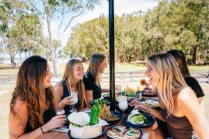 a group of women sitting at a table with food at Kangarooms Noosa Everglades in Cootharaba +28 photos