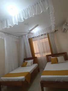Lova arba lovos apgyvendinimo įstaigoje 3RD Ave. Beach Apartment Nyali, Mombasa, North Coast
