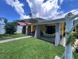 a house with a view of the water at Villa Tavares - casa com piscina na praia da Lagoinha in Ubatuba