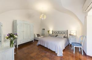 Postel nebo postele na pokoji v ubytování B&B I Tre Camini