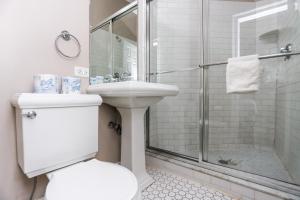 a bathroom with a shower and a toilet and a sink at Heart of South End, Convenient, Comfy Studio #42 in Boston