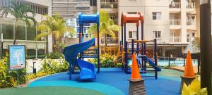 a playground in a resort with a slide at Royal Deluxe & Private Apartments - West Jakarta in Jakarta