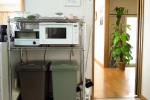 Kuchyň nebo kuchyňský kout v ubytování TESHIKAGA HOSTEL MISATO