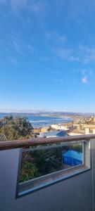 a view of a city from the balcony of a building at Habitacion Nofal 2 - Pleno CENTRO in Los Vilos