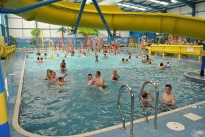 a group of people in a swimming pool at Golden Anchor Caravan Park, Europa Sequoia Private Static Caravan Hire on Wildflower Meadow in Chapel Saint Leonards
