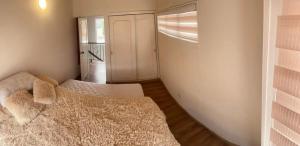 En eller flere senge i et værelse på CASA PRIVADA EN BOGOTA