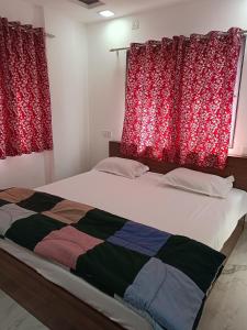 מיטה או מיטות בחדר ב-Soumil Homestay
