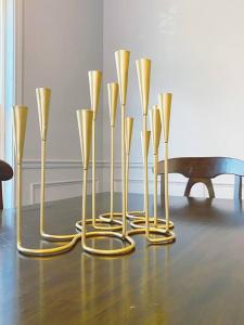 a group of gold vases sitting on a table at Entire Home Downtown ATL! Walk to GWCC and more! in Atlanta