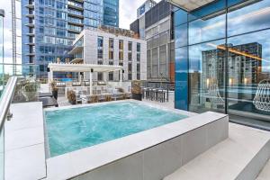a swimming pool on top of a building at Beautiful Downtown condo with Pool and Parking in Montreal
