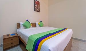 Postel nebo postele na pokoji v ubytování Itsy Hotels Avani Stays, Vyttila, Kochi