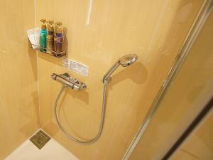 a shower in a bathroom with a shower at Hotel Opera in Tokyo