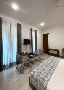 TV a/nebo společenská místnost v ubytování Anamiva, Goa - AM Hotel Kollection + 37 fotografií
