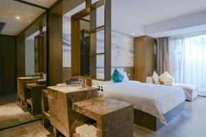 Krevet ili kreveti u jedinici u okviru objekta Paco Hotel Tiyuxilu Metro Guangzhou-Free Shuttle Bus during Canton Fair