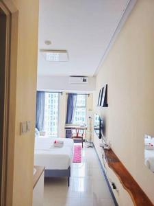 Μια τηλεόραση ή/και κέντρο ψυχαγωγίας στο Amadeuss at Anderson Apartment