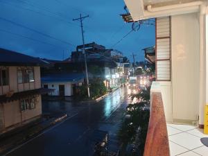 a view of a city street at night at #1 Green Room Inn Siargao in General Luna