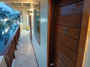 a door to a restaurant with a view of a street at #1 Green Room Inn Siargao in General Luna