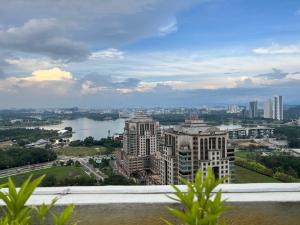 a view of a city with a river and buildings at Aisha’s staycation big patio Putrajaya in Putrajaya