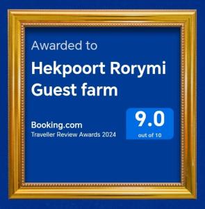 a picture frame with a sign for a guest farm at Hekpoort Rorymi Guest farm in Hekpoort