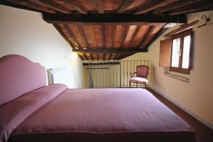 A bed or beds in a room at La Terrazza sulla Val d'Orcia