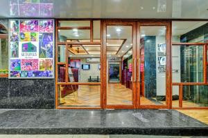 a store front with glass doors and a wooden floor at Season 4 Residences - Teynampet Near Apollo Hospital ,Balaji Dental, US Consulate in Chennai